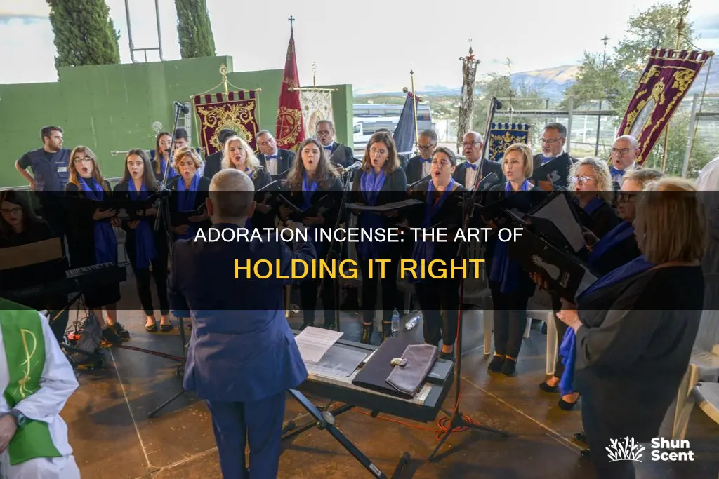 how to hold the incense for adoration